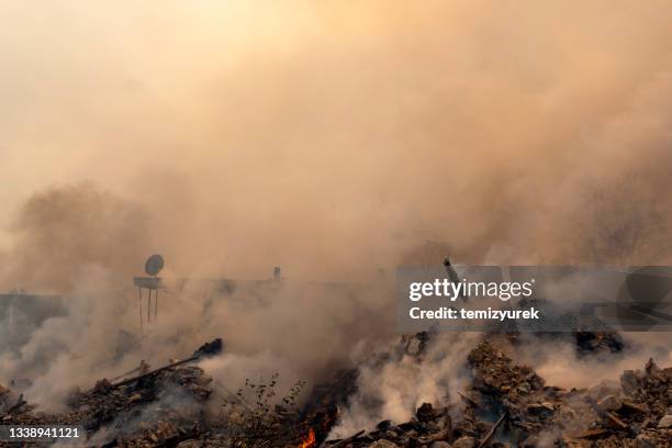 burning demolished house - ruin stock pictures, royalty-free photos & images