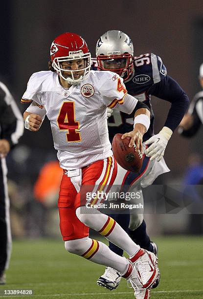Tyler Palko of the Kansas City Chiefs is chased by Mark Anderson of the New England Patriots in the second half at Gillette Stadium on November 21,...