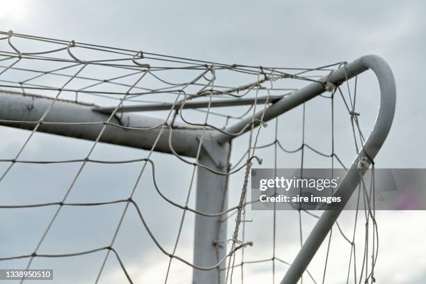 close up of low angle view of soccer goal top corner against a sunny sky - football goal post stock pictures, royalty-free photos & images