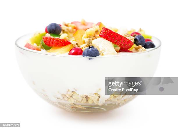 bowl of yogurt, fresh fruit and muesli for healthy breakfast - cereal bowl stockfoto's en -beelden
