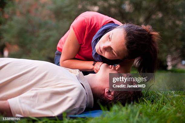first aid - look, listen and feel for breathing. - first aid kit stock pictures, royalty-free photos & images