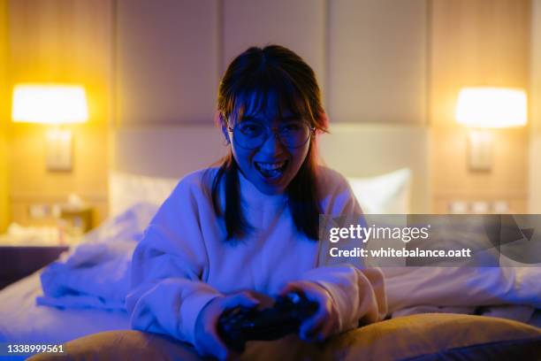 crazy woman playing games - best female act stock pictures, royalty-free photos & images