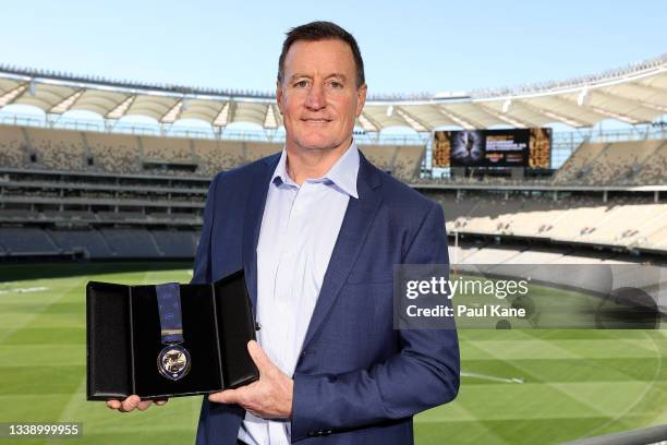 John Worsfold poses with the 2021 AFL Jock McHale medal during a media opportunity ahead of the AFL Grand Final, at Optus Stadium on September 08,...