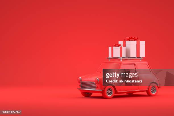 concetto di vacanza di viaggio di natale, auto rossa, scatola regalo, sfondo rosso - 3d box foto e immagini stock