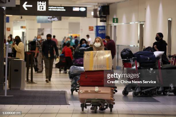 Arriving travelers leave Toronto Pearson International Airport on September 7, 2021 in Toronto, Canada.