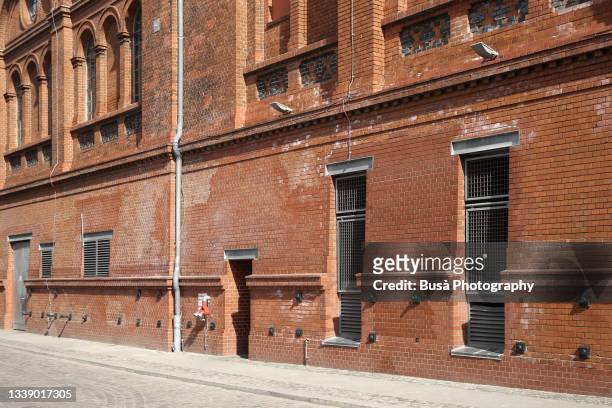 brick wall of former industrial building in berlin, germany - outdoor brewery stock pictures, royalty-free photos & images