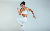 Monochrome portrait of a fit woman exercising