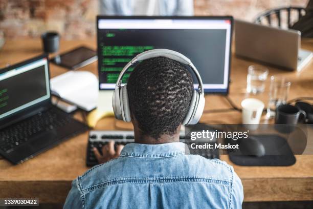 Black Man Behind Computer Photos and Premium High Res Pictures - Getty ...