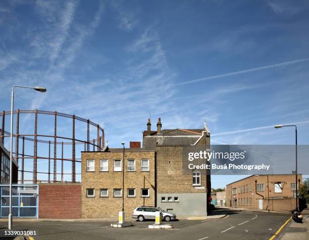 old gasometer in dalston, east london, in the london borough of hackney - city country stock pictures, royalty-free photos & images