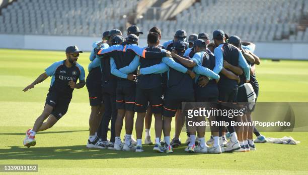 Virat Kohli of India runs around his teammates during a training session before Friday's Fifth Test Match between England and India at Old Trafford...