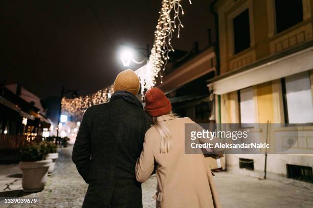christmas walk - winter town stock pictures, royalty-free photos & images