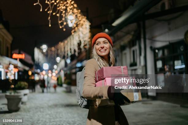 joy of buying christmas presents - retail stockfoto's en -beelden