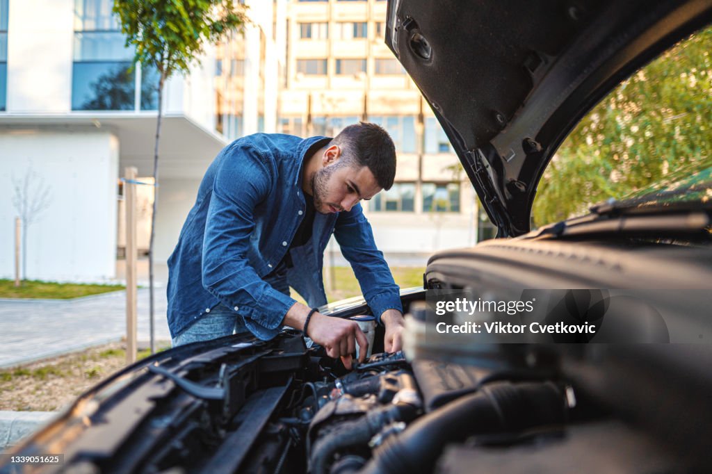 Looking under car hood