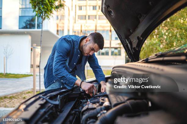 looking under car hood - capô de carro imagens e fotografias de stock