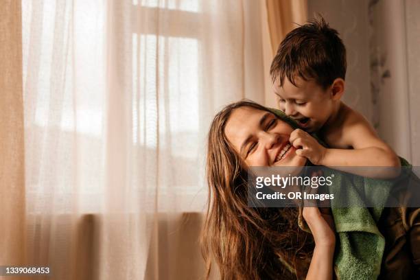 happy mother with playful little son at home - mom bildbanksfoton och bilder