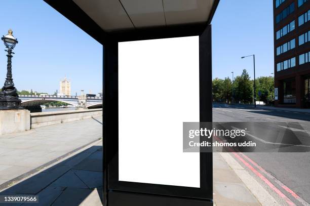 blank advertising billboard at a bus stop in central london - london landmark ストックフォトと画像