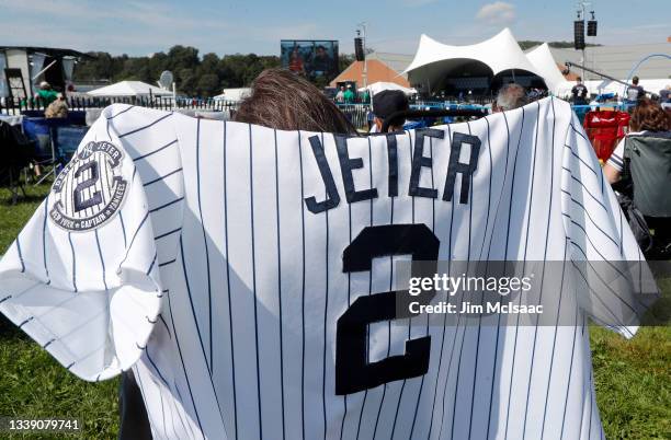 Jersey of inductee Derek Jeter is seen on a chair prior to the start of the Baseball Hall of Fame induction ceremony at Clark Sports Center on...