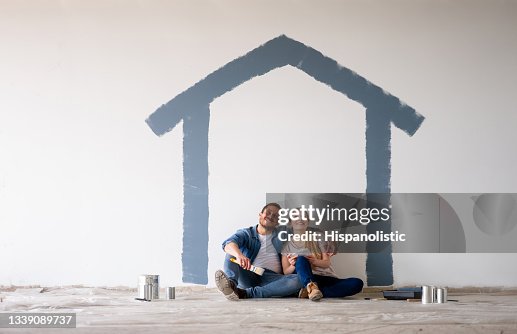 Couple painting their house and daydreaming about how itâs going to look Couple painting their house and daydreaming about how itâs going to look