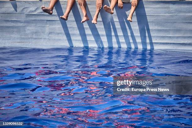 Several of the migrants traveling in a skiff sighted by the NGO Open Arms from the boat 'Astral', on September 8 in the Mediterranean Sea, in the...