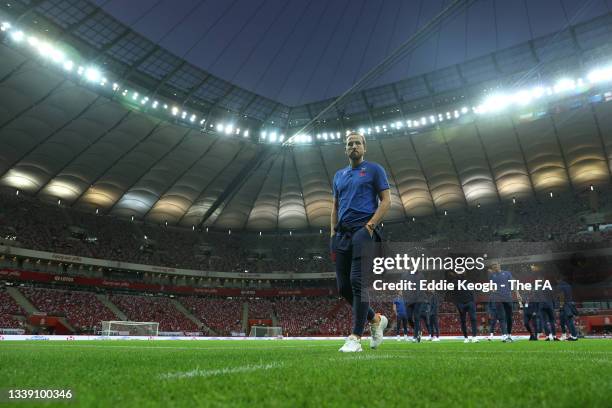 Harry Kane of England and teammates inspect the pitch prior to the 2022 FIFA World Cup Qualifier match between Poland and England at Stadion Narodowy...