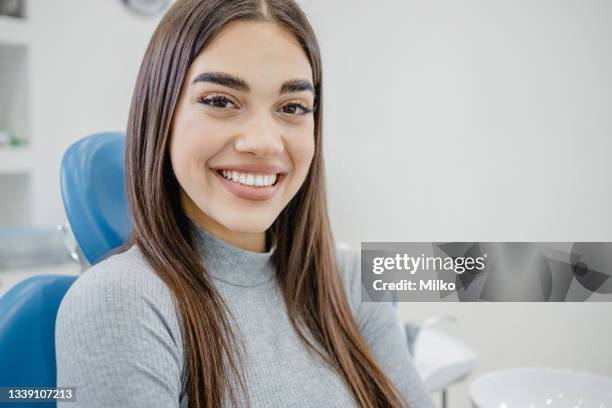 process of dental treatment at the dentist - dentists chair stockfoto's en -beelden