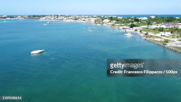 high angle view of sea against clear blue sky,marsh harbour,bahamas - bahamas aerial bildbanksfoton och bilder