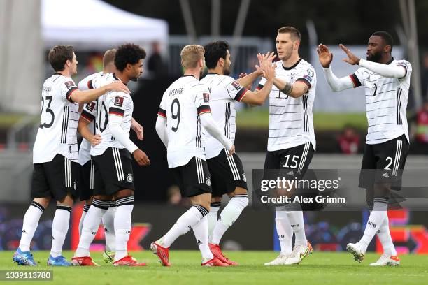 Serge Gnabry of Germany celebrates with and team mates after scoring their side's first goal during the 2022 FIFA World Cup Qualifier match between...