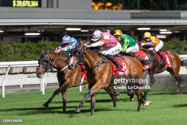 Jockey Harry Bentley riding Turin Redstar wins the Race 6 Community Chest Cup at Happy Valley Racecourse on September 8, 2021 in Hong Kong.