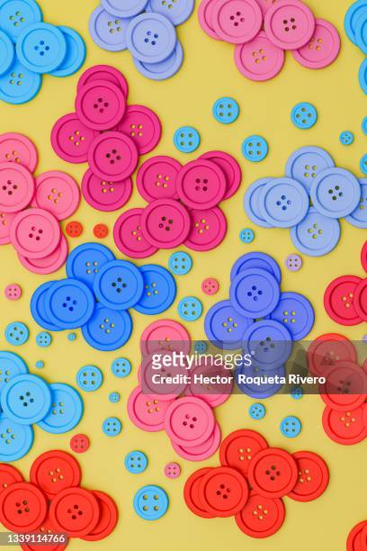 many blue, red and yellow shirt buttons with  yellow background, copy space - multi coloured buttons stock pictures, royalty-free photos & images