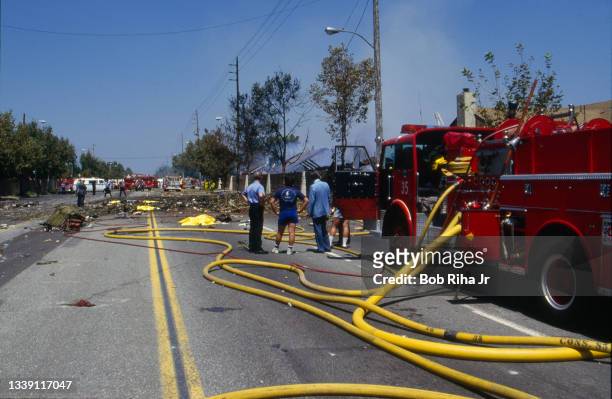 Los Angeles County firefighters and mutual aid agencies work within the debris field after a mid-air collision with Aeromexico Flight 498 and Piper...