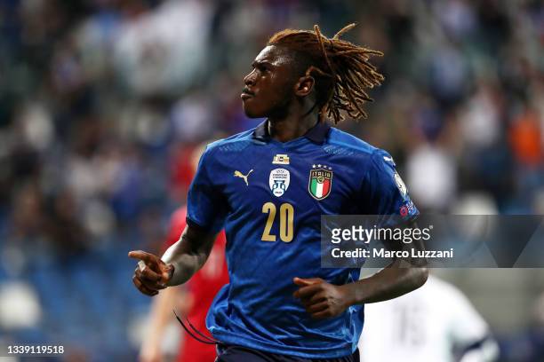 Moise Kean of Italy celebrates after scoring their side's fourth goal during the 2022 FIFA World Cup Qualifier match between Italy and Lithuania at...