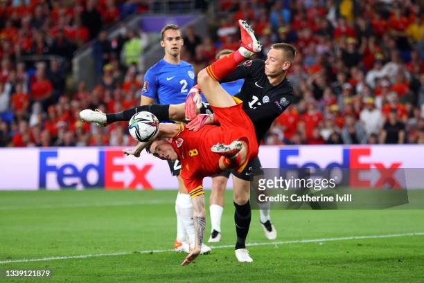 Harry Wilson of Wales and Karl Jakob Hein of Estonia battle for possession during the 2022 FIFA World Cup Qualifier match between Wales and Estonia...