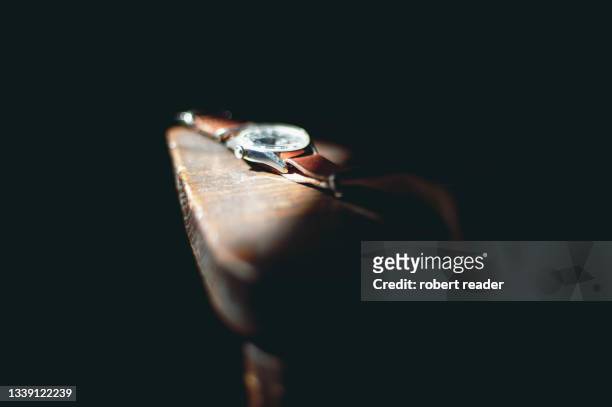 vintage watch on wooden chair - luxury watches stock pictures, royalty-free photos & images