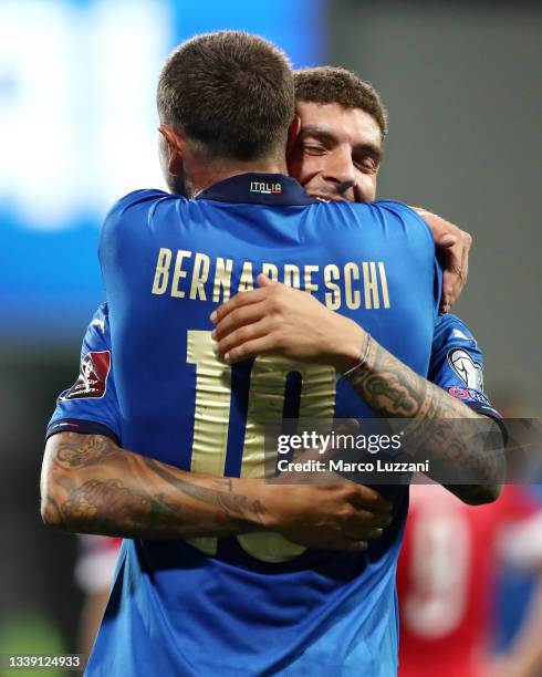 Giovanni Di Lorenzo of Italy celebrates with Federico Bernardeschi after scoring their side's fifth goal during the 2022 FIFA World Cup Qualifier...