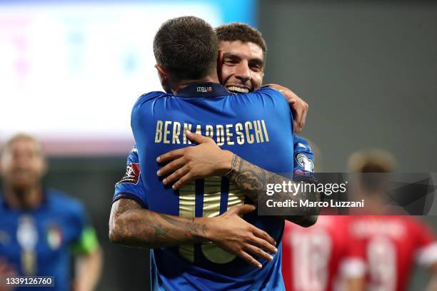 Giovanni Di Lorenzo of Italy celebrates with Federico Bernardeschi after scoring their side's fifth goal during the 2022 FIFA World Cup Qualifier...