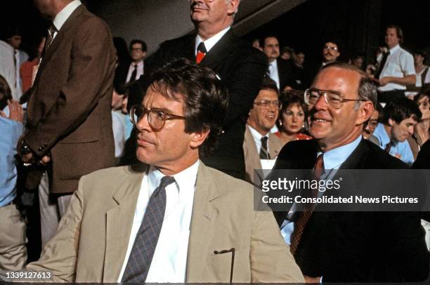 View of American actor and activist Warren Beatty and Chairman of the Democratic National Committee Charles Manatt as they watch the proceedings of...