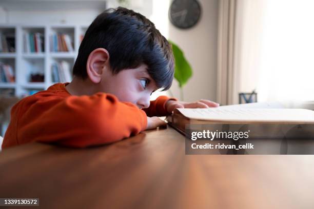 child tired and bored of doing homework - furious child stock pictures, royalty-free photos & images