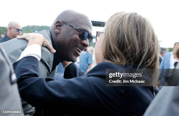 Hall of Famer Michael Jordan greets Dorothy Jeter, mother of inductee Derek Jeter, during the Baseball Hall of Fame induction ceremony at Clark...