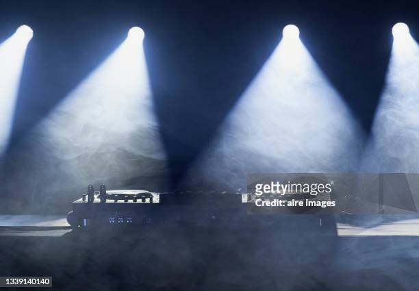 front view of illuminated dj station entertainment mixer equipment - mixing deck stock pictures, royalty-free photos & images