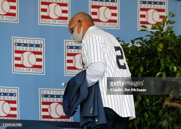 Hall of Famer Reggie Jackson attends the Baseball Hall of Fame induction ceremony wearing a jersey of inductee Derek Jeter at Clark Sports Center on...
