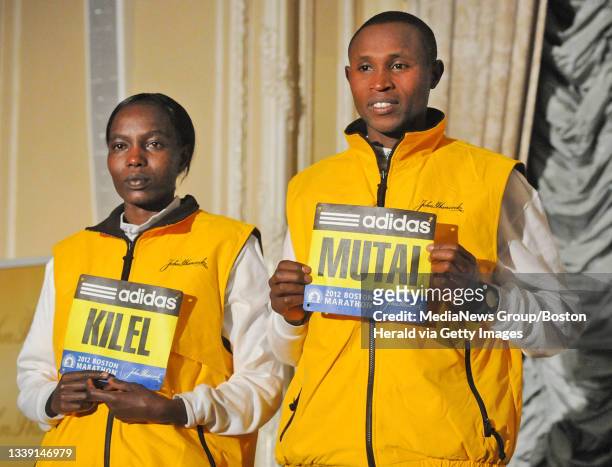 Boston, MA - Kenyans Caroline Kilel and Geoffery Mutai are introduced to reporters during Breakfast of Champions, prior to competing in the 116th...