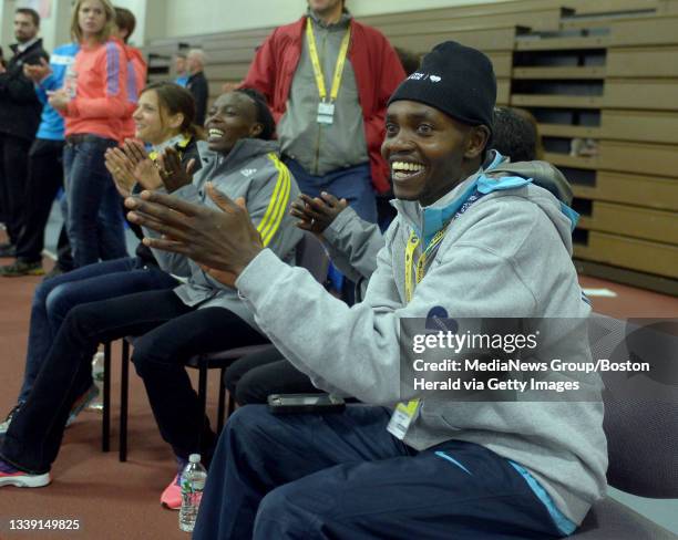 Marathon elite runner Micah Kogo from Kenya cheers on the Boston high school track athletes at the John Hancock Scholars and Stars program at the...