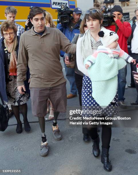 Jeff Bauman, who lost both legs in the Boston Marathon bombing, arrives at the scene of one of the blasts with his wife, Erin Hurley, and daughter,...