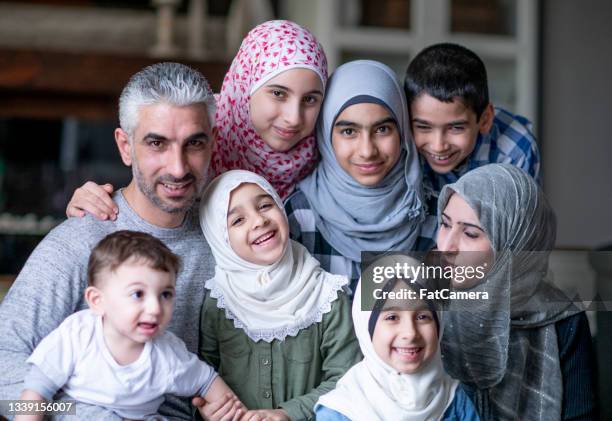 portrait of a large muslim family - afghani stock pictures, royalty-free photos & images