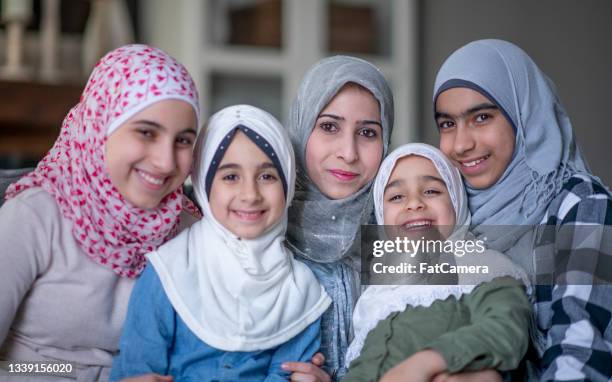 muslim mother and her four daughters - veiling stock pictures, royalty-free photos & images