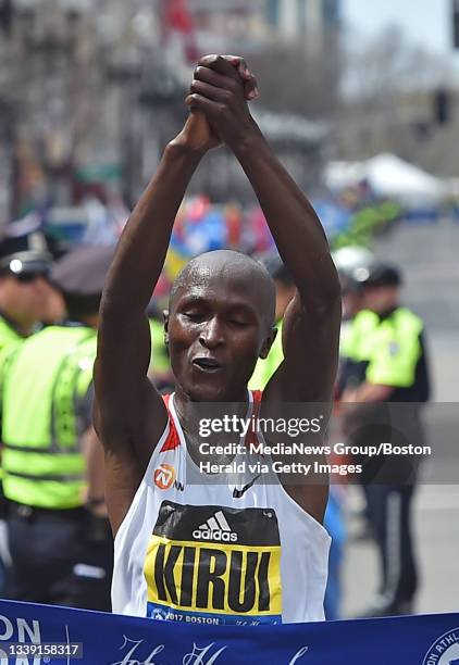 Geoffrey Kirui, of Kenya celebrates as he wins the men's division of the 121th Boston Marathon in Boston on Monday, April 17, 2017. Staff photo by...