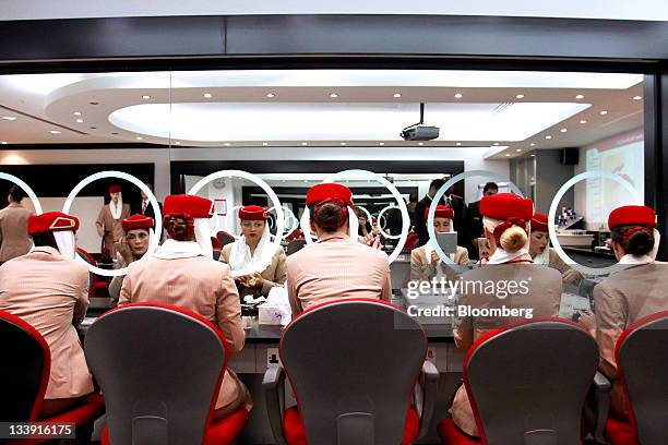 Aircrew students with Emirates Airline, sit and apply make-up, during a training session at the Emirates Aviation College in Dubai, United Arab...