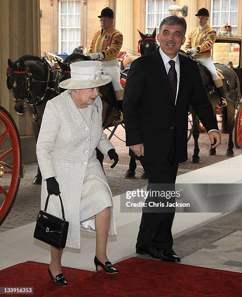 Queen Elizabeth II greets Dr Abdullah Gül the President of the Republic of Turkey, steps from the Royal Carriage as she arrives at Buckingham Palace...