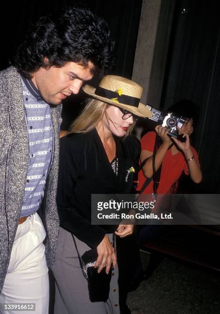 Actress Priscilla Presley and boyfriend Marco Garibaldi attend the "Les Miserables" performance on August 22, 1988 at the Shubert Theatre in Century...