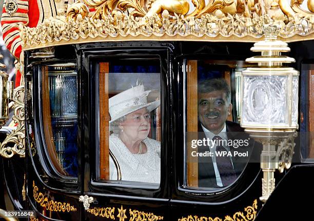 Queen Elizabeth II and Dr Abdullah Gul the President of the Republic of Turkey arrive in the Royal Carriage as they arrive at Buckingham Palace on...